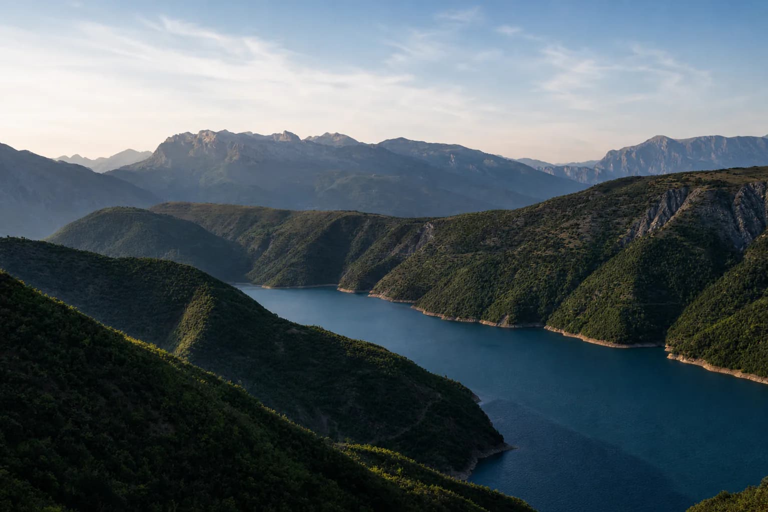 Highland reservoir and mountains of Kukës at dawn